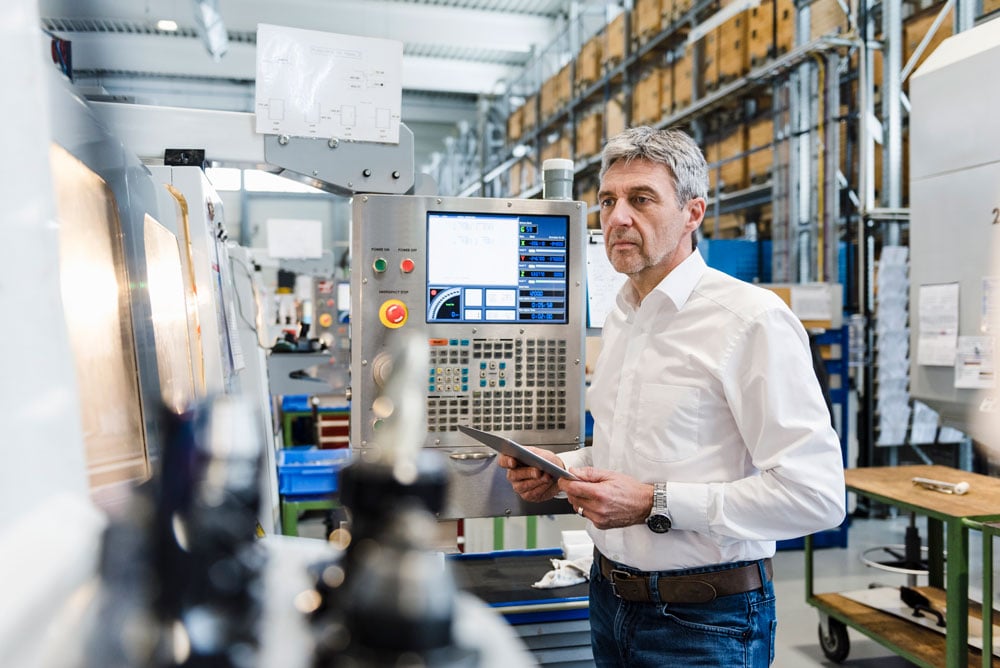 businessman-using-tablet-in-production-hall2